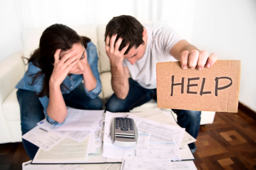 Image of young couple stressed out because of finances